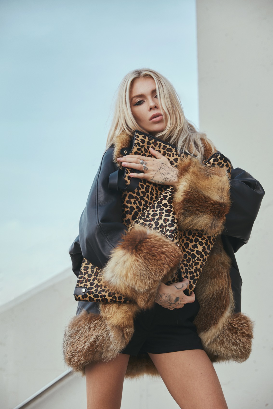 Model in a leopard and fur coat